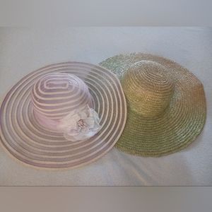 2 sun hats - a pink sun hat and a green/natural straw sun hat.